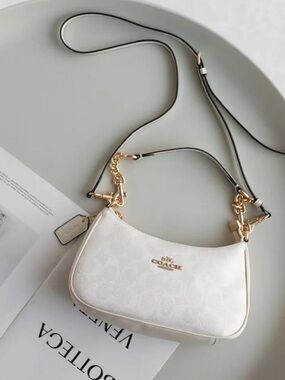 Coach White Leather Shoulder Bag with Gold Hardware and Black-Trim Strap